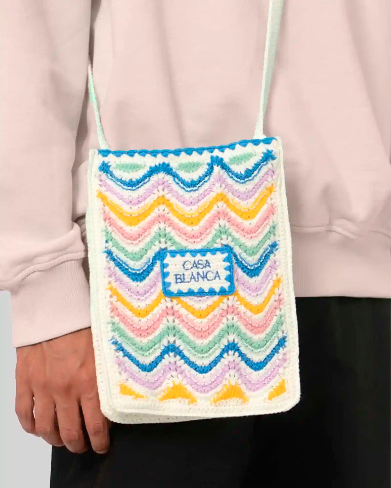 Close-up of Casablanca mini wave crochet bag on model