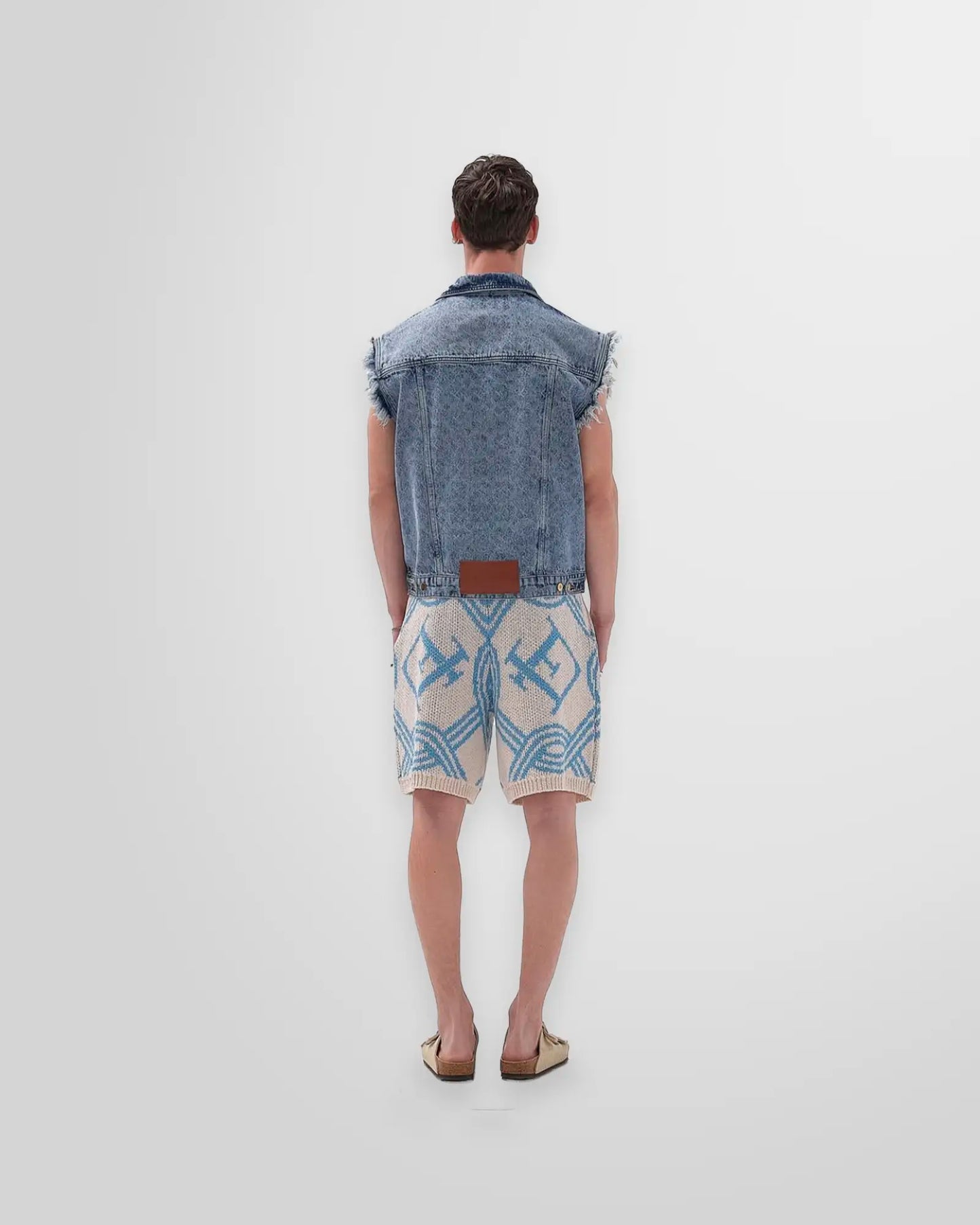 Back view of Luca Ferreira Acid Washed Denim Vest showcasing the premium faded denim and sleeveless design.