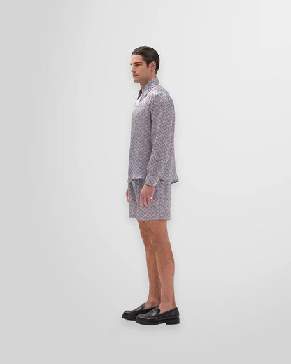 Model wearing Luca Ferreira Ornament Silk Shirt styled with silk shorts, ideal for formal or semi-formal occasions.